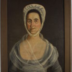 Oil painting of a dark-haired white woman with a white bonnet, transparent shawl, and blue silk dress